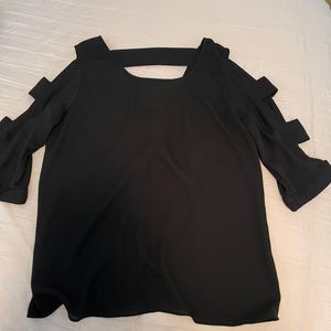 Black long sleeve with key hole sleeves.